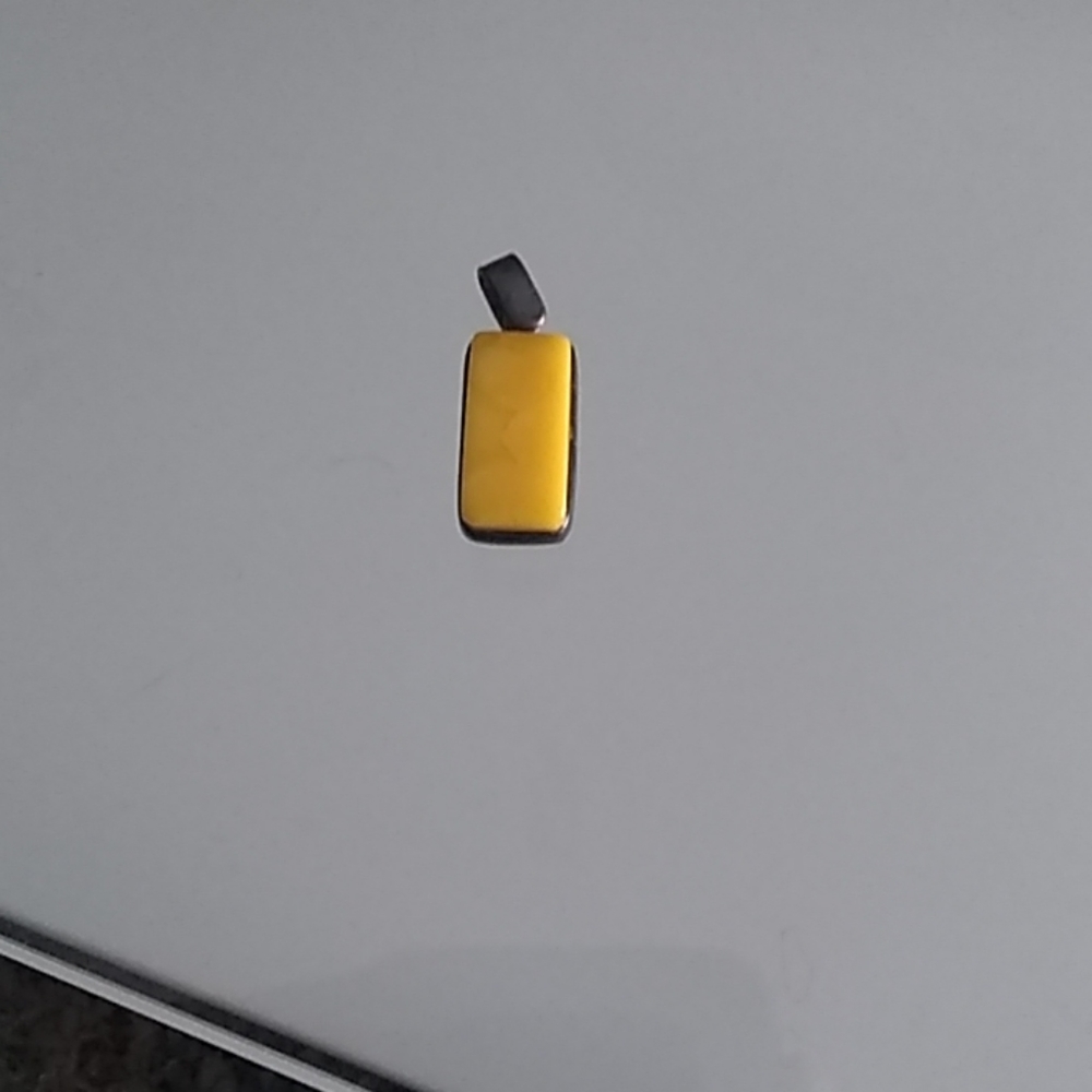 Genuine yellow amber set in silver length is 3 cm